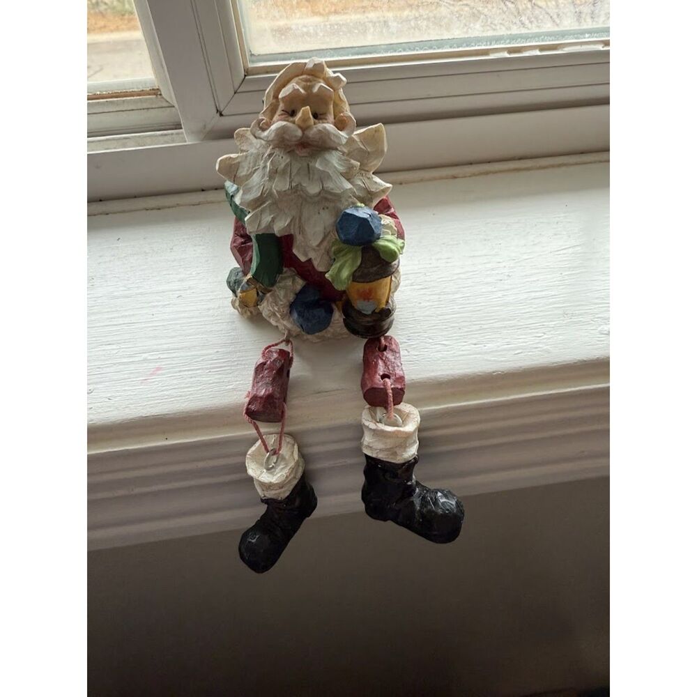 Christmas Santa Sitting on  Shelf with lantern
